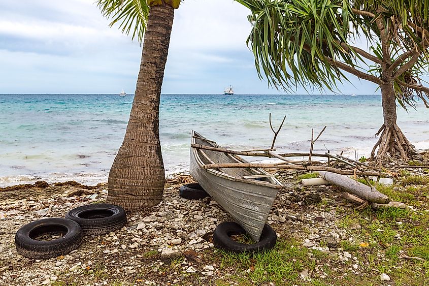 Traditional Polynesian outrigger canoe shore of Funafuti atoll lagoon in Tuvalu 