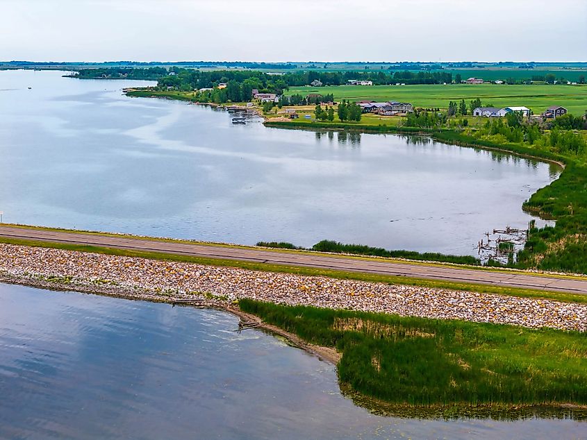 A scenic road extending into Devils Lake, North Dakota, connecting the mainland to Grahams Island State Park.